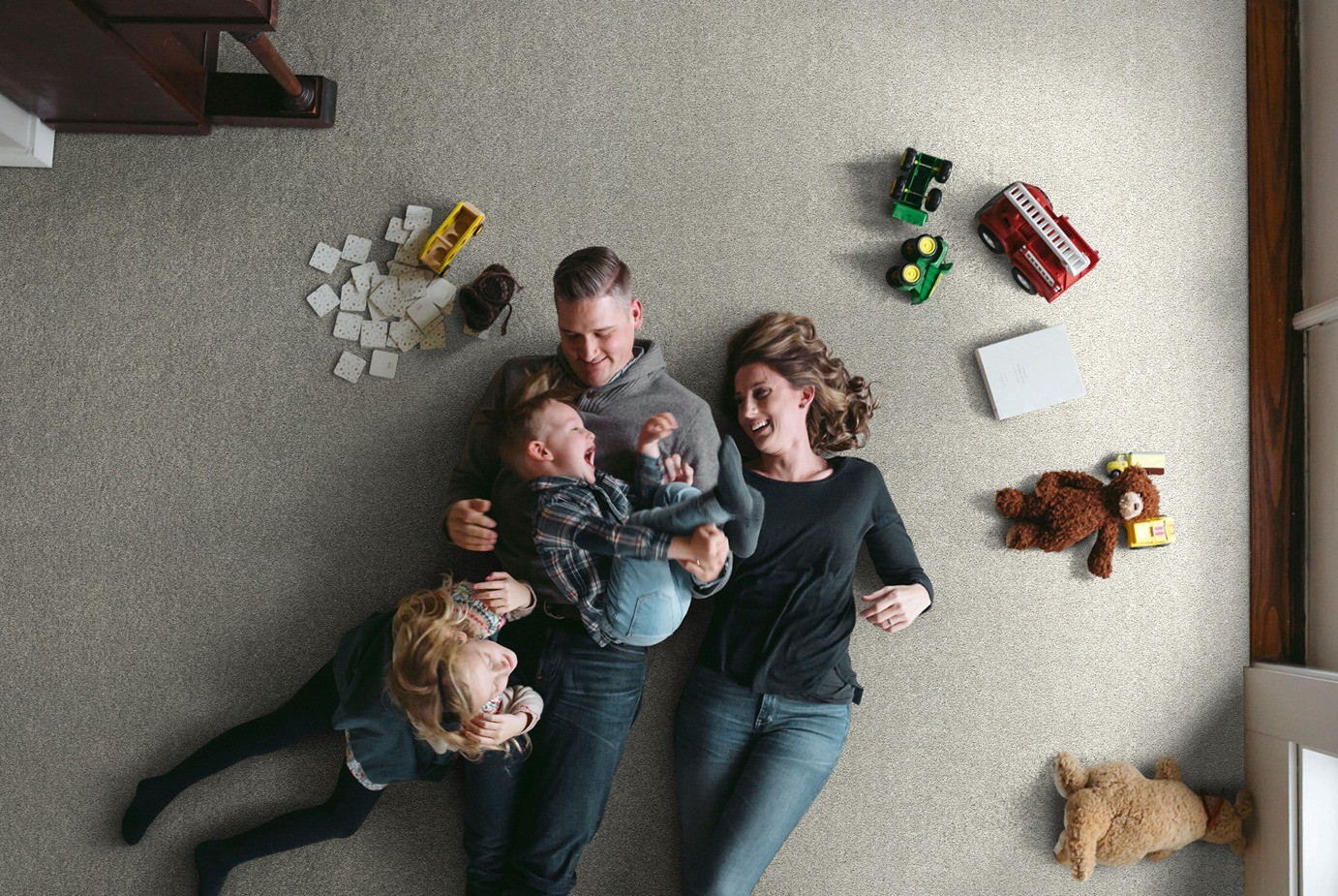 Basic-Rules-E9639-Flax-00502-family (1) Happy family on carpet | Rodgers Floor Covering