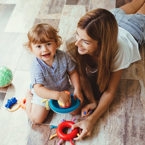 Mom with child playing | Rodgers Floor Covering